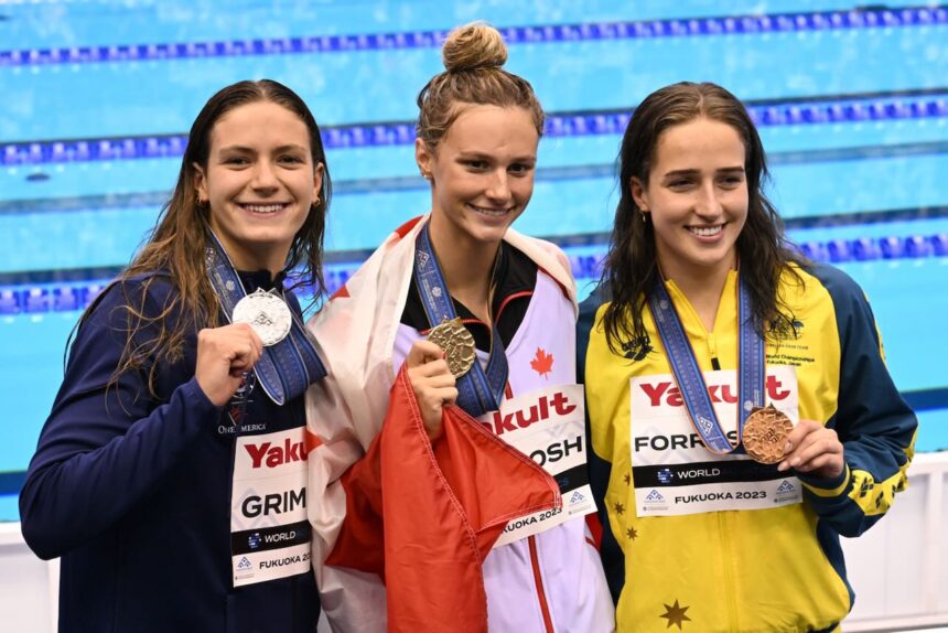 Americans finish with flourish as Canadian McIntosh wins second swimming gold