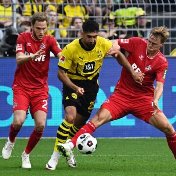 Malen strikes late to hand Dortmund victory over Cologne