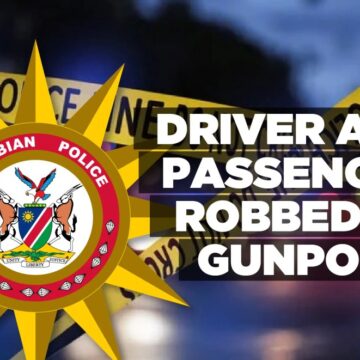 Driver and passenger robbed at gunpoint