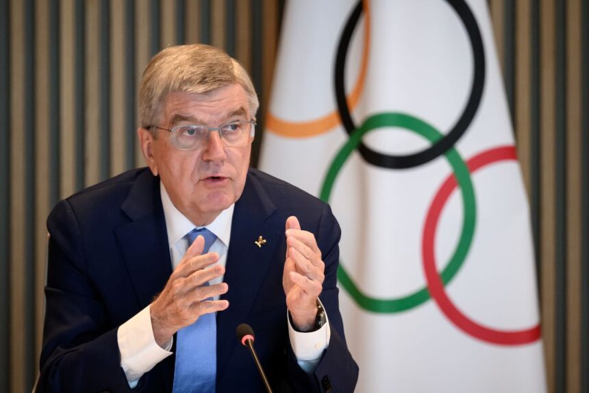 IOC president Bach coy as members call for rule change to extend his term